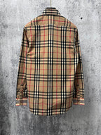 Plaid long-sleeve button-up shirt, back view, black tan and red checks