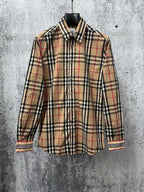 Burberry long-sleeve button-up shirt in beige plaid with navy and red stripes at cuffs