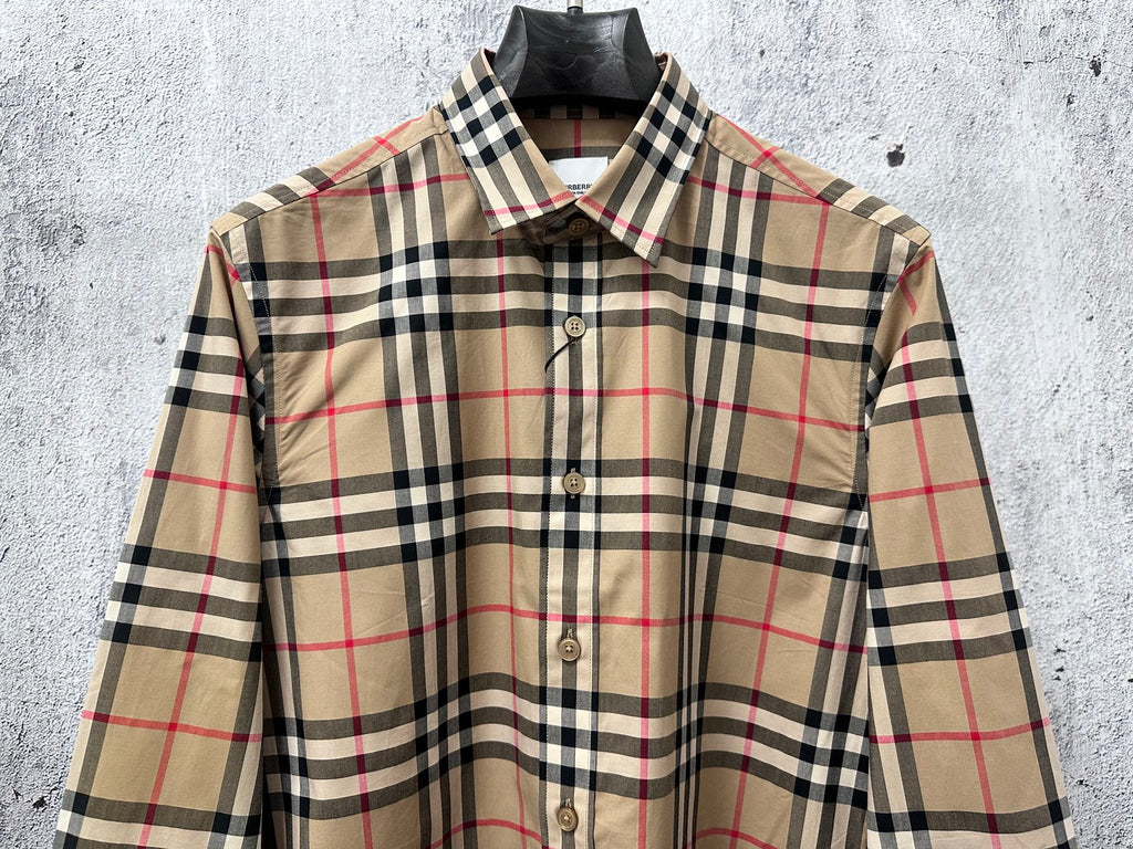 Plaid button-up shirt front view with button placket and long sleeves