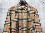 Plaid long-sleeve button-up shirt with button front and collar