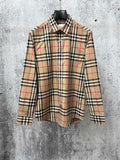 Burberry plaid button-up shirt with pointed collar, button placket, long sleeves