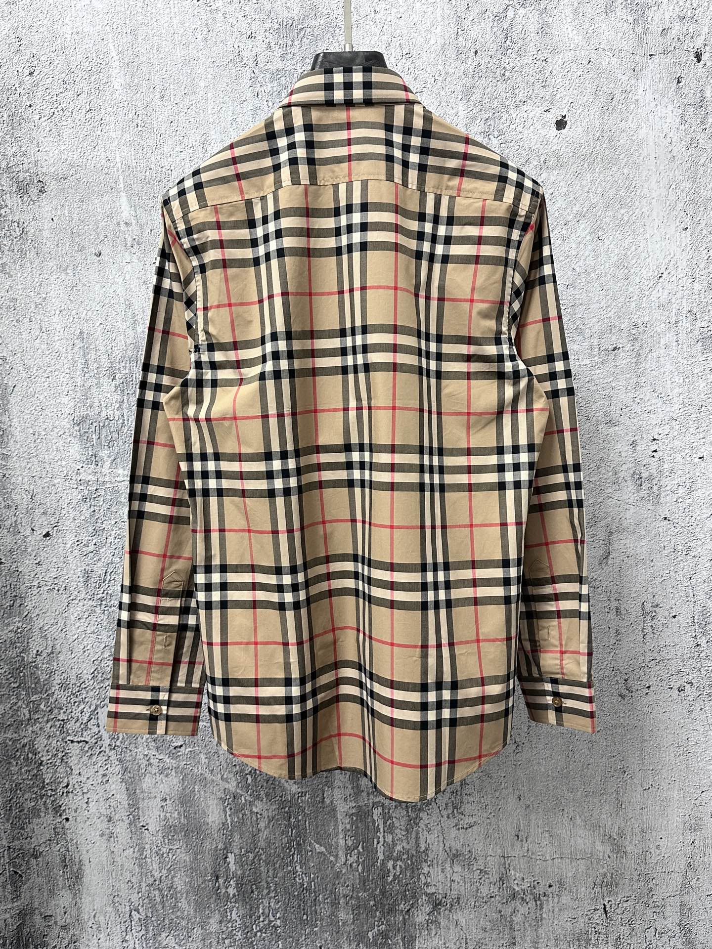Plaid button-up shirt back view with long sleeves and pointed collar