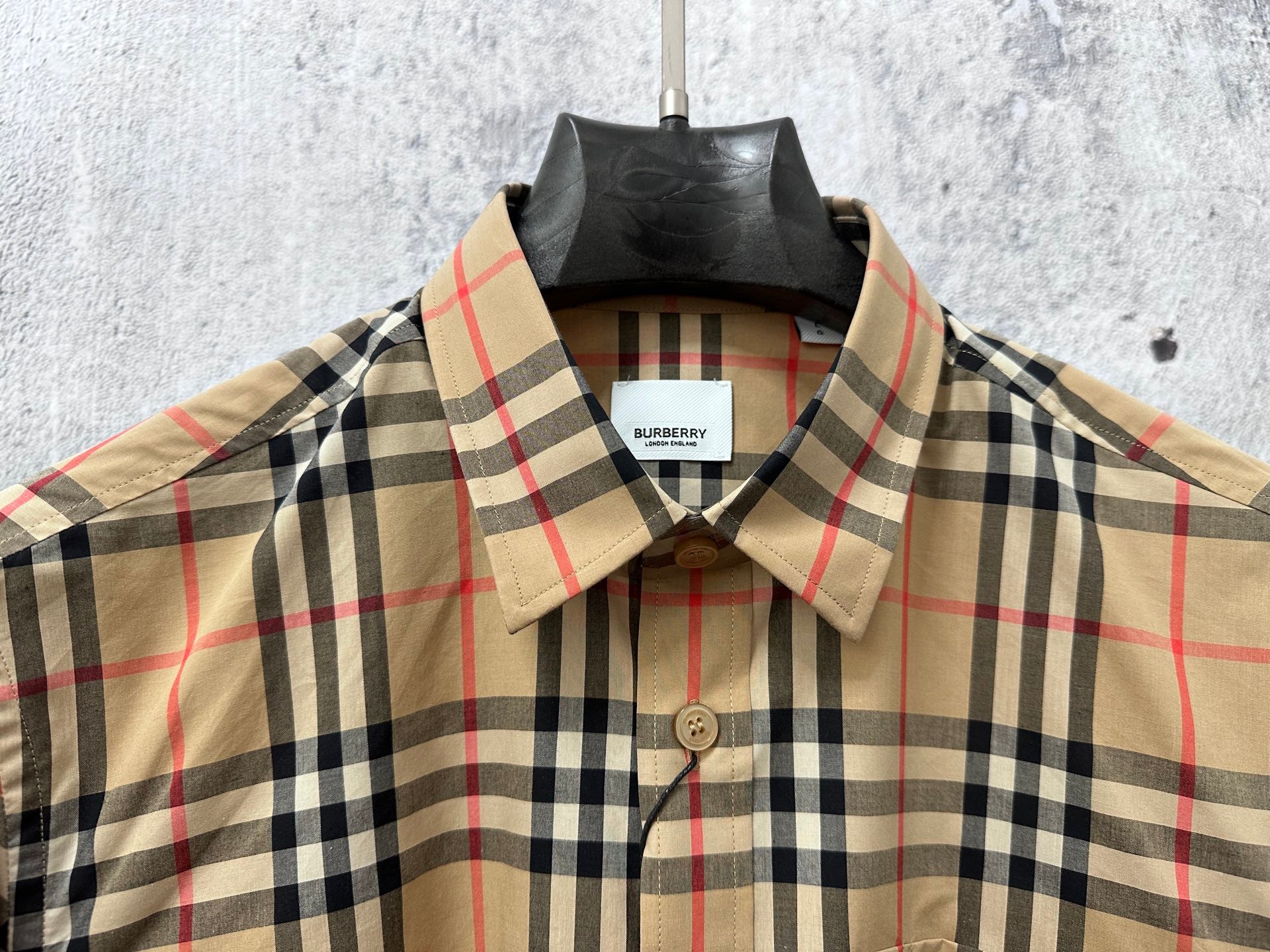 Burberry plaid shirt neckline with buttons and collar, beige, black, and red check
