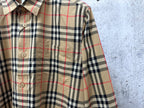 Burberry plaid long-sleeve shirt side view with buttoned front and flap pocket
