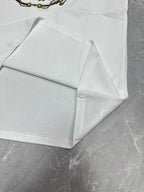 White short-sleeve T-shirt fold and hem seam detail