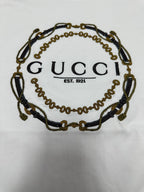 White short-sleeve T-shirt close-up of Gucci chain logo