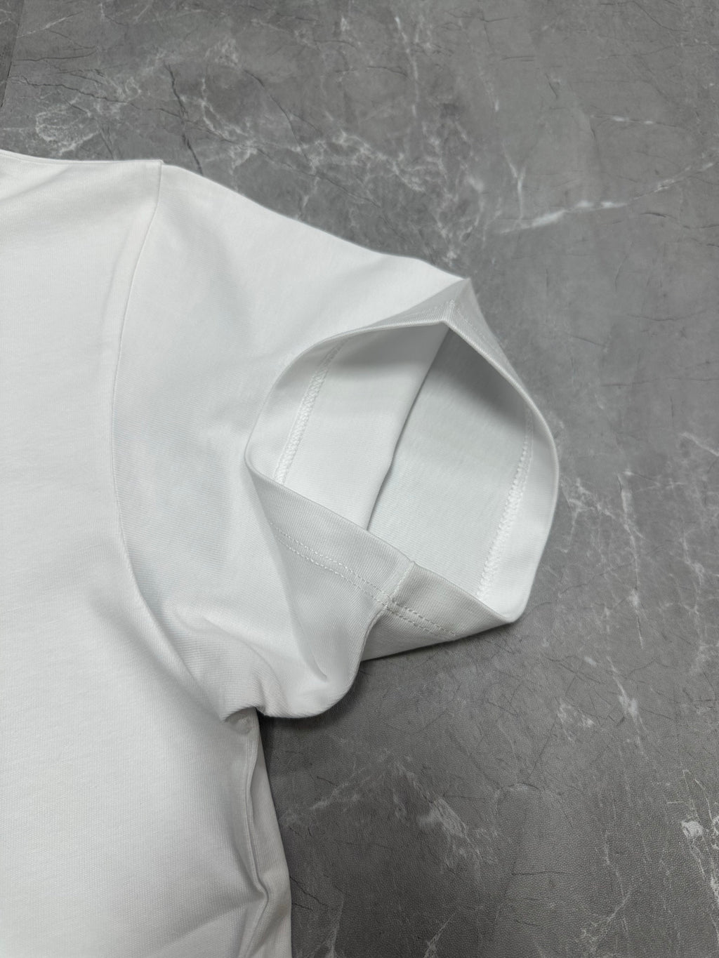 White short-sleeve T-shirt neckline and shoulder seam