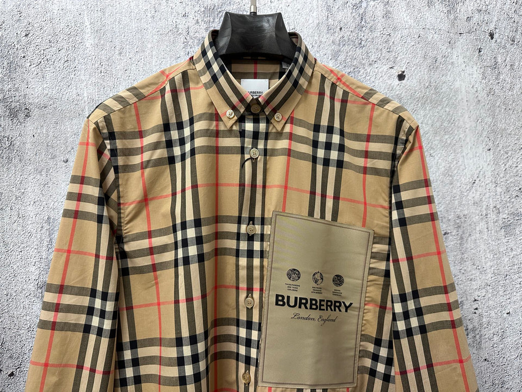 Burberry plaid button-up shirt with front pocket and logo patch