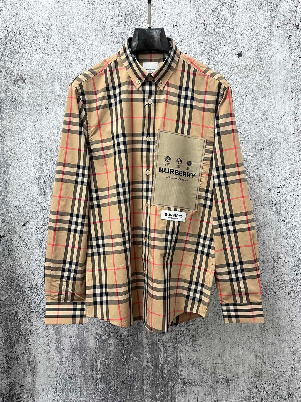 Burberry plaid button-up shirt with chest logo patch and long sleeves