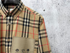 Burberry plaid button-up shirt front with pocket and buttons detail