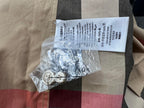 Burberry plaid shirt fabric with white care label, beige with black and red check