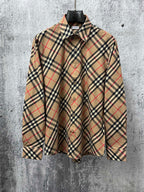 Burberry plaid long-sleeve shirt with buttoned collar, beige with navy and red lines.