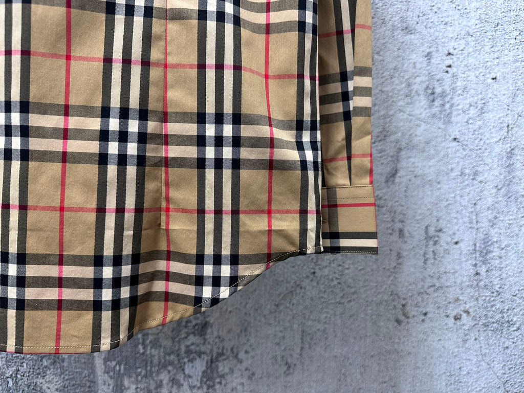 Burberry plaid long-sleeve shirt close-up on side and lower hem