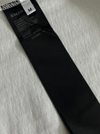 Balenciaga T-shirt size M care label on inside black tag, on light fabric