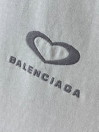 Balenciaga T-shirt fabric close-up of heart logo and BALENCIAGA lettering