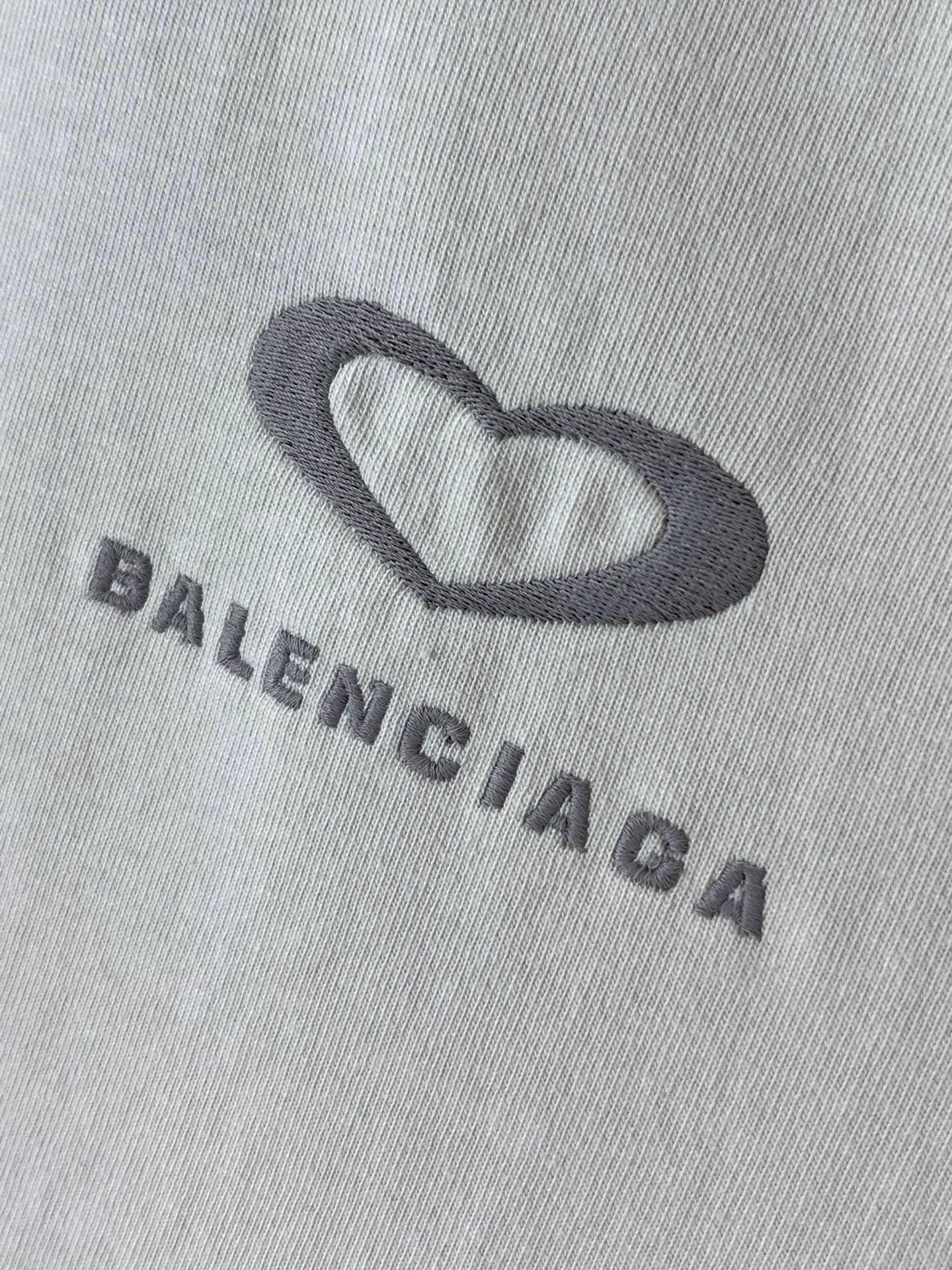 Balenciaga T-shirt fabric close-up of heart logo and BALENCIAGA lettering