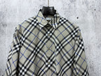 Burberry plaid button-up shirt front view with chest buttons