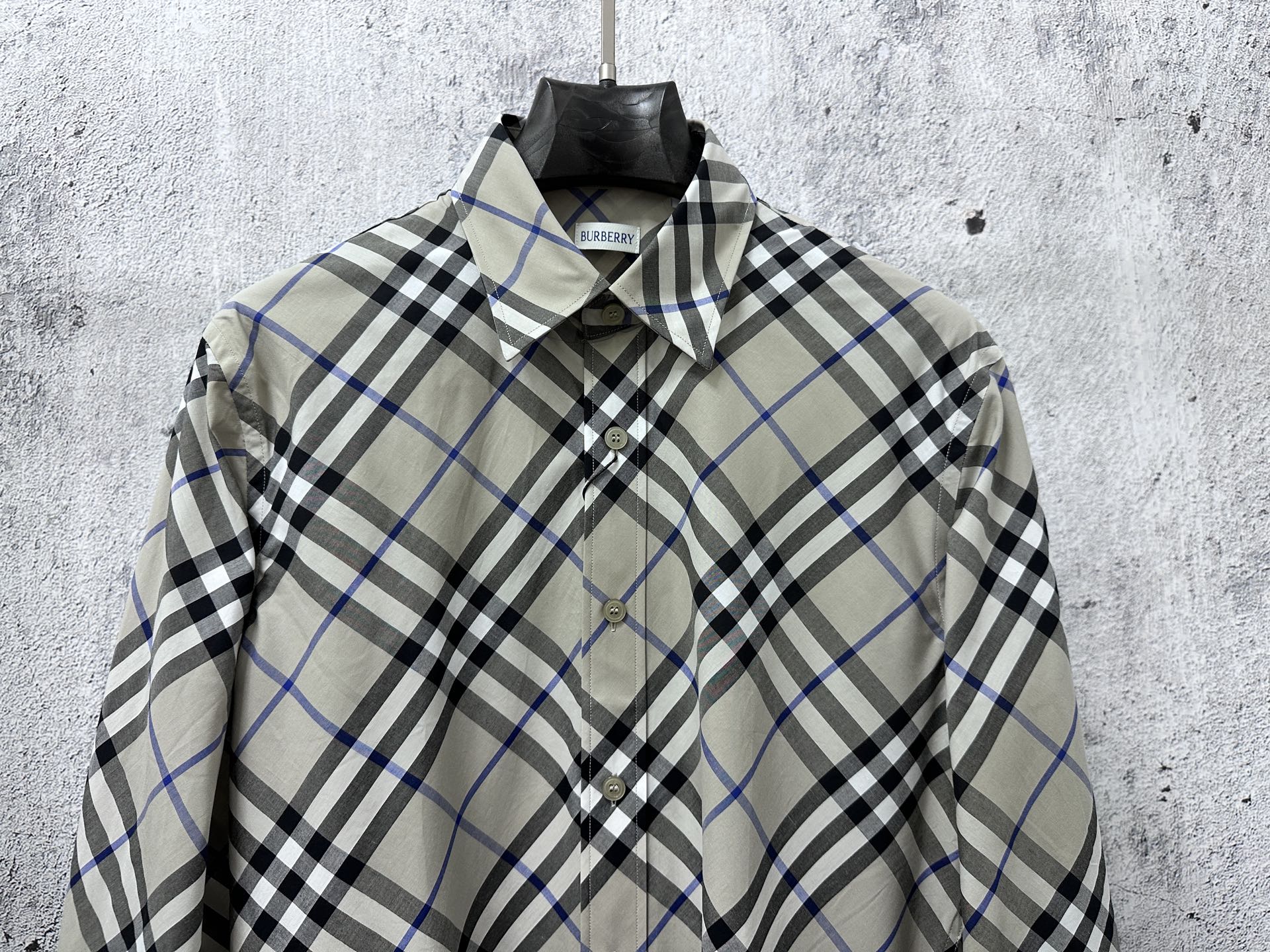 Burberry plaid button-up shirt front view with chest buttons