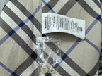 Burberry plaid shirt fabric label and spare buttons in plastic bag