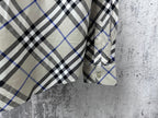 Plaid shirt sleeve cuff and buttoned placket detail