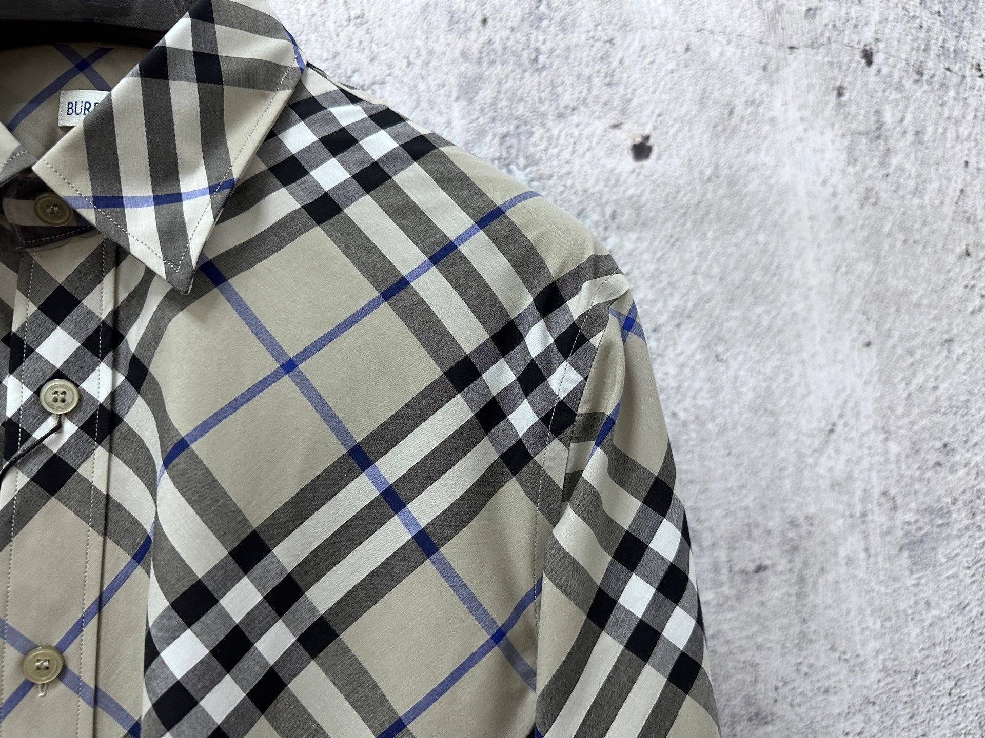 Plaid Burberry shirt close-up of collar and button placket