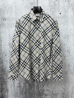 Burberry plaid button-up shirt with pointed collar and long sleeves