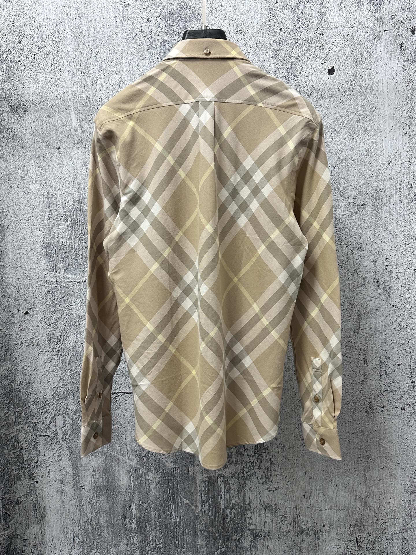 Light tan plaid long-sleeve button-up shirt, back view with buttoned yoke