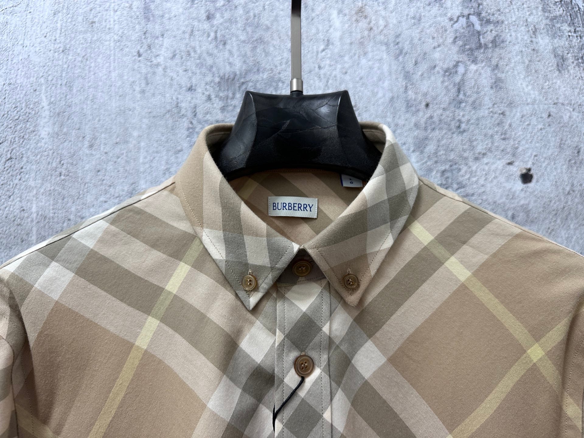 Light tan plaid button-up shirt with pointed collar and brown buttons, Burberry tag
