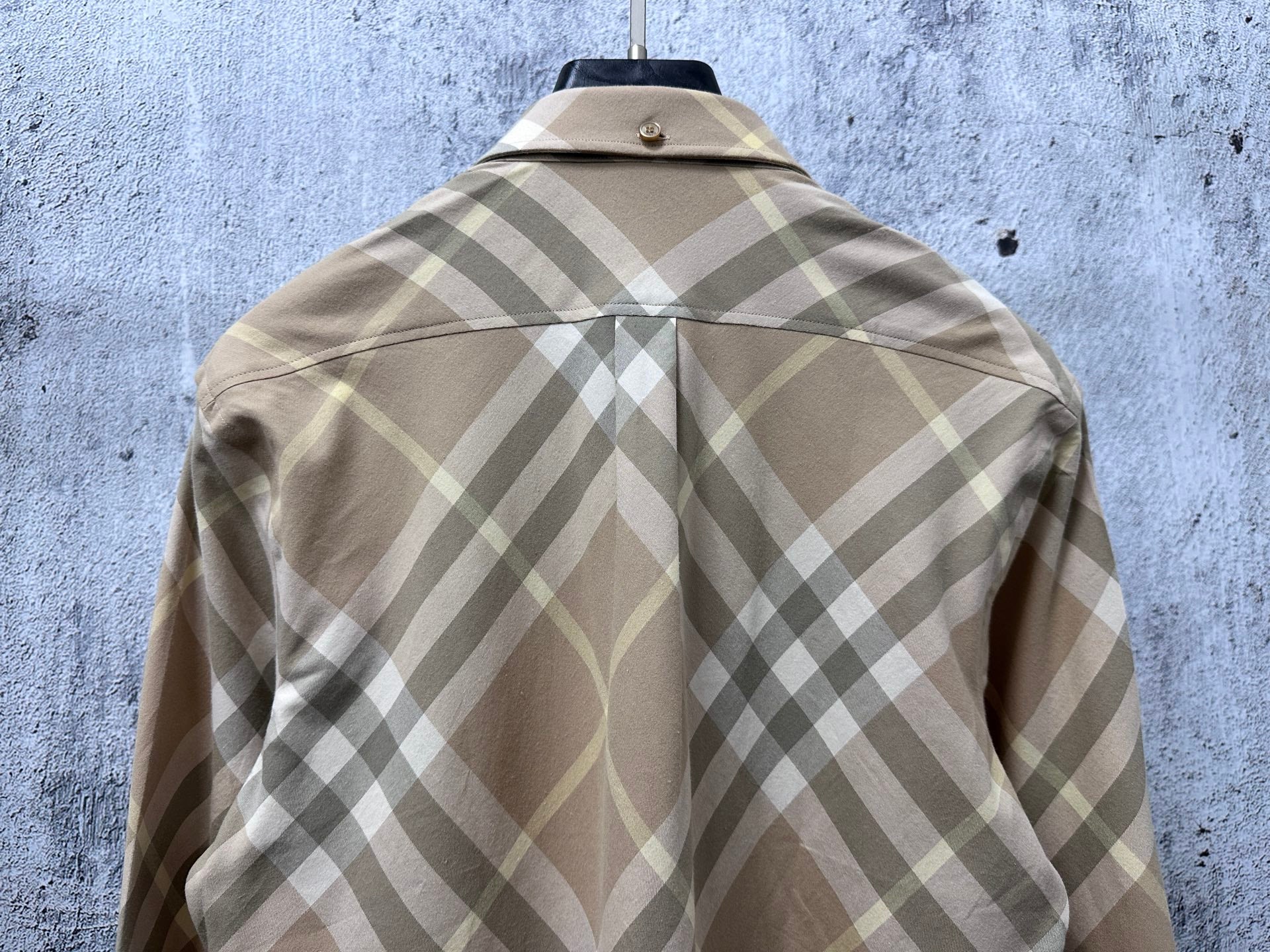 Light tan plaid long-sleeve button-up shirt back view with center seam detail