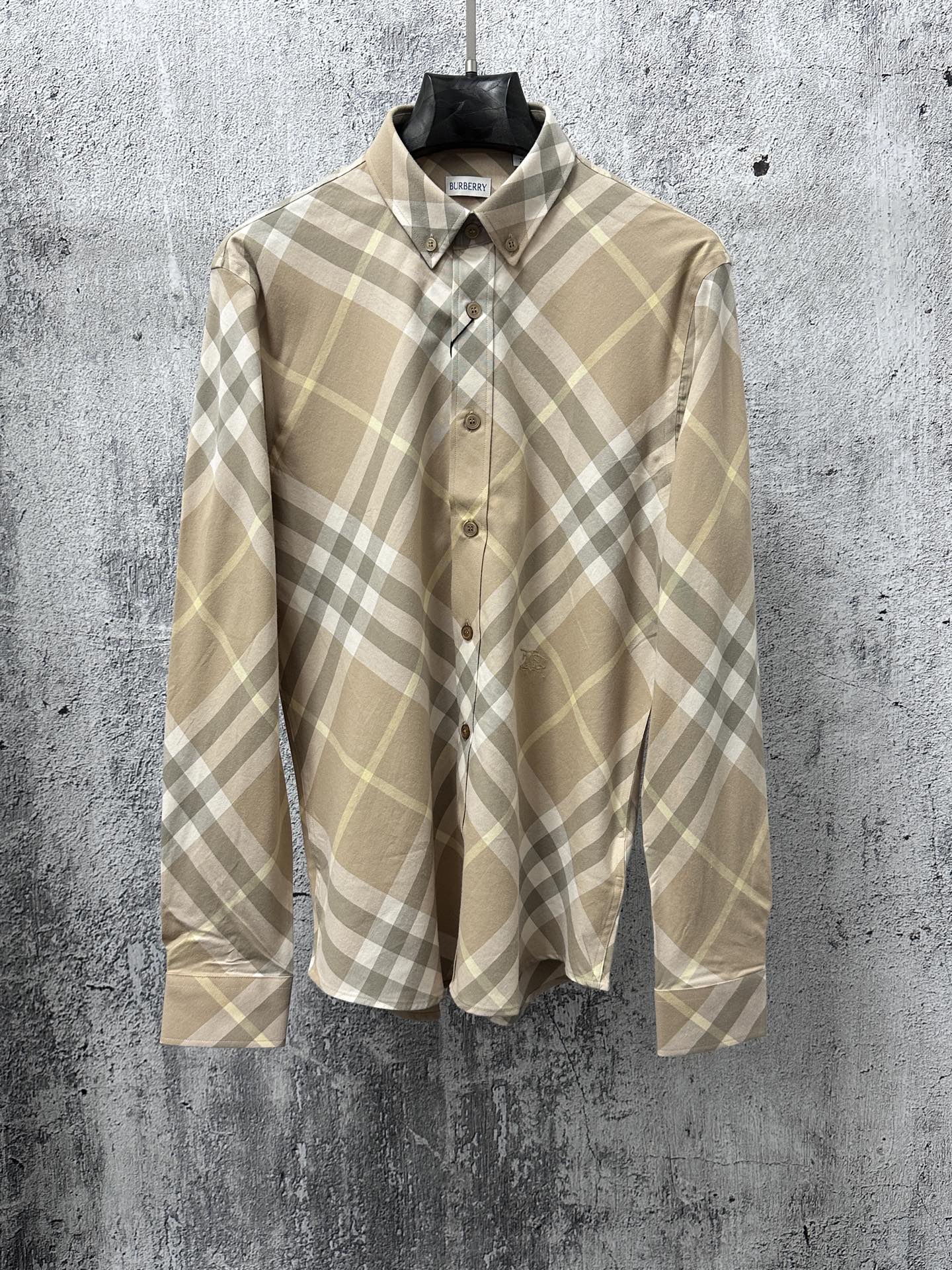 Light tan plaid long-sleeve button-up shirt with buttoned collar and Burberry label