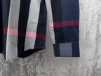 Burberry plaid button-up shirt sleeve cuff detail with navy and gray panels