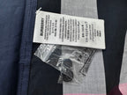 Burberry care label and spare buttons for plaid shirt