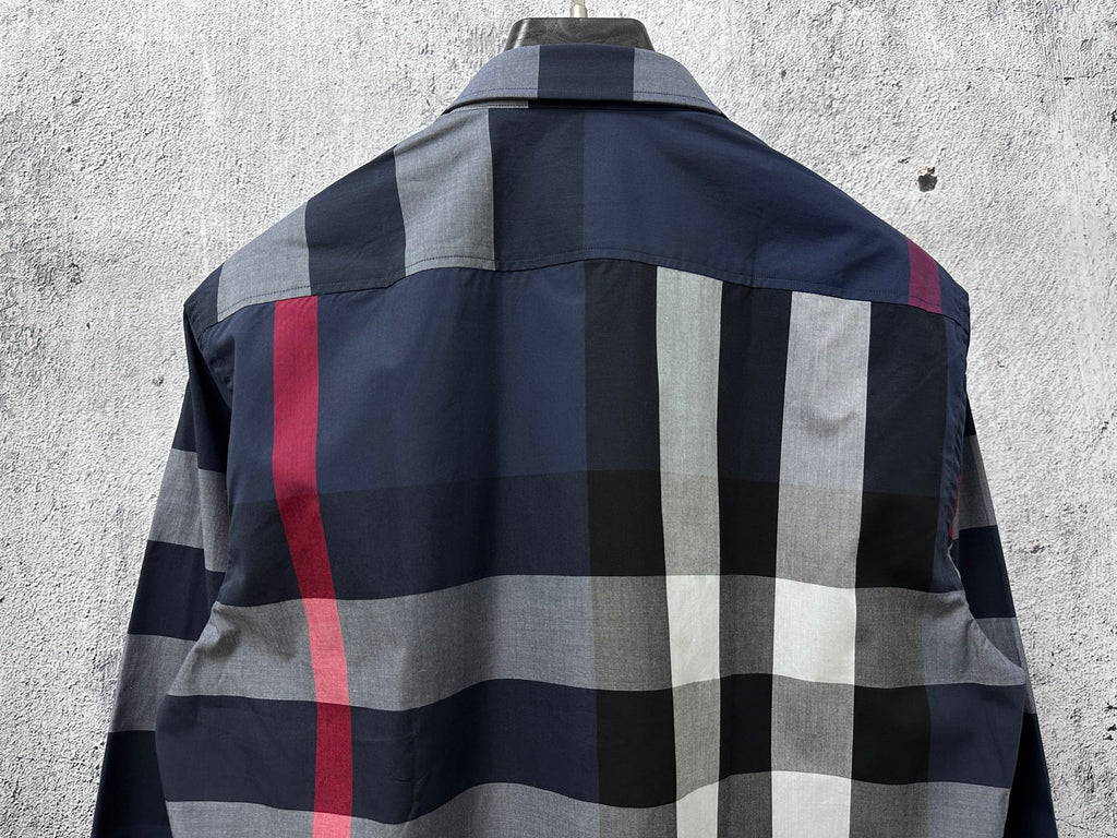 Plaid shirt back yoke with dark navy and white blocks and red stripe detail