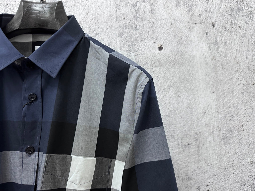 Burberry plaid button-up shirt close-up of pointed collar and button placket