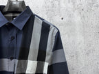 Burberry plaid button-up shirt close-up of pointed collar and button placket