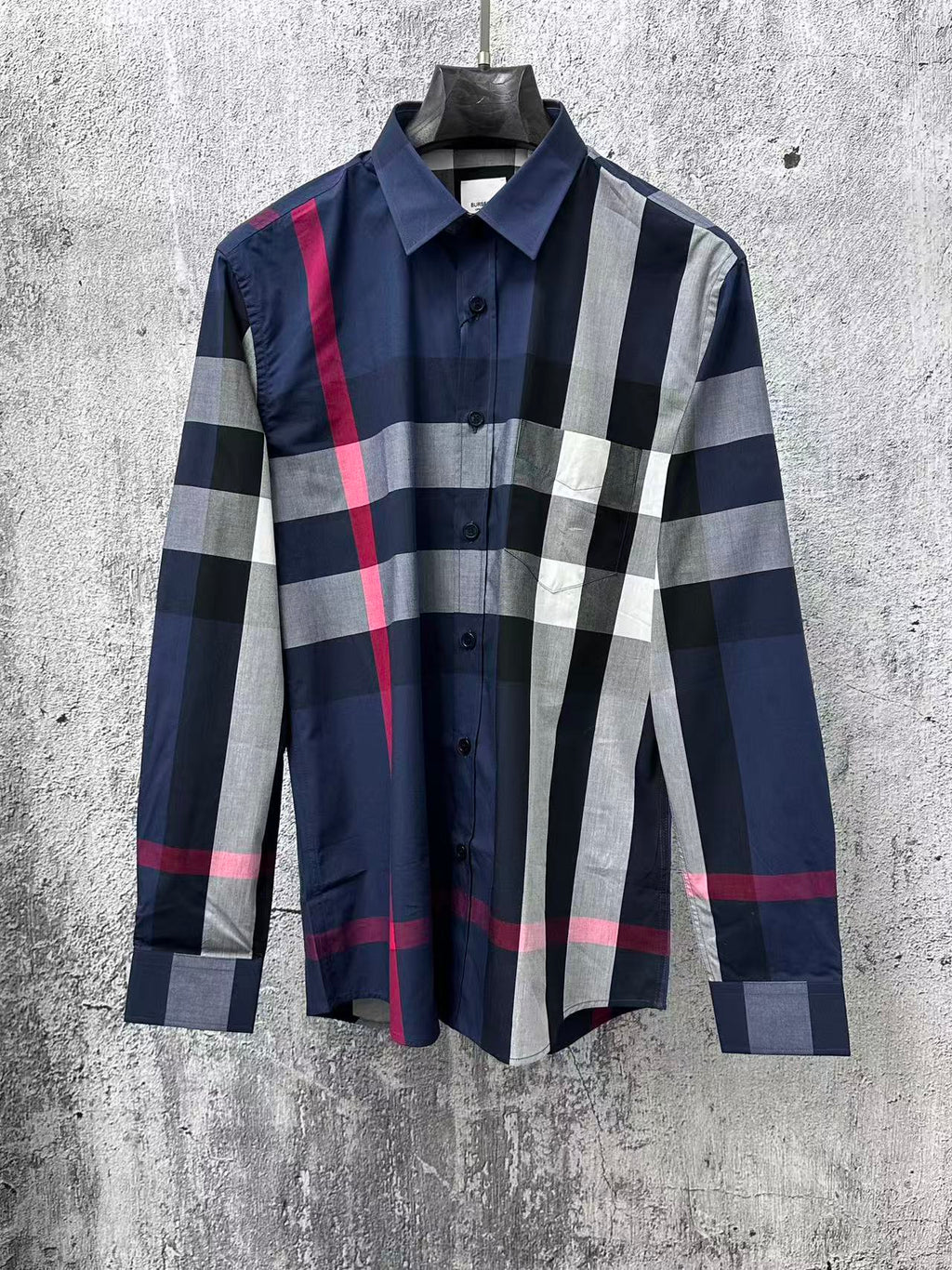 Plaid button-up shirt with long sleeves, navy, white, and red check pattern