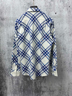 Long-sleeve button-up shirt in blue and cream plaid, back view with yoke