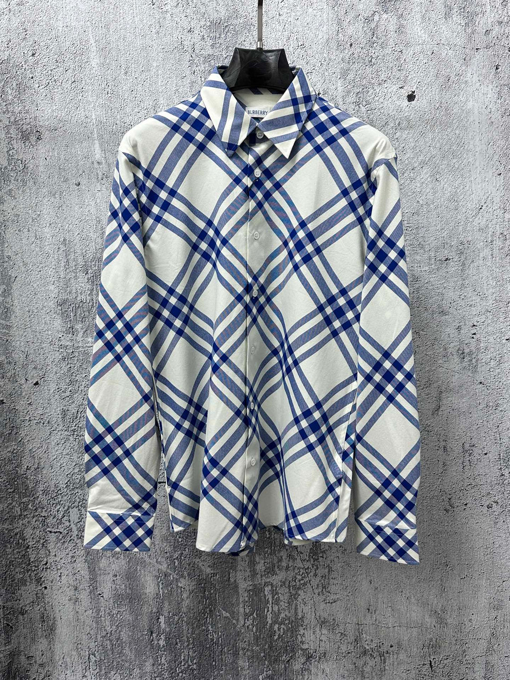 Long-sleeve button-up shirt in blue and cream plaid with pointed collar