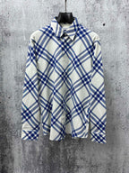 Long-sleeve button-up shirt in blue and cream plaid with pointed collar