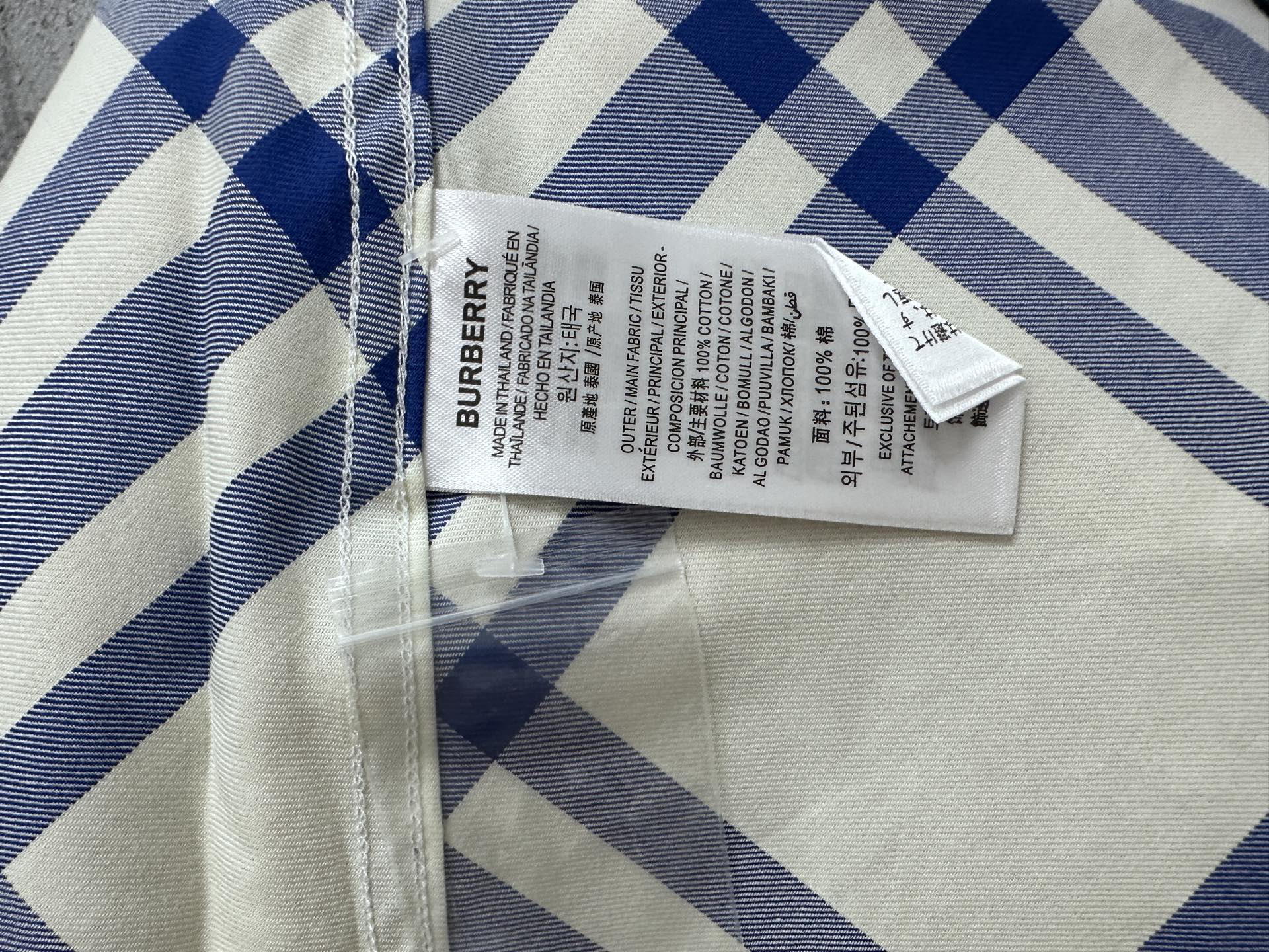Burberry plaid shirt with interior care label and cream-blue check fabric