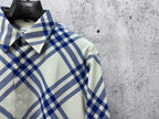 Plaid button-up shirt collar and front buttons in blue and cream