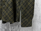 Plaid shirt hem and side pocket opening in dark green with yellow grid