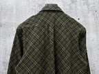 Back view of a plaid button-up shirt in dark green with yellow grid lines