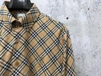 Burberry plaid shirt chest close-up with buttons and logo patch