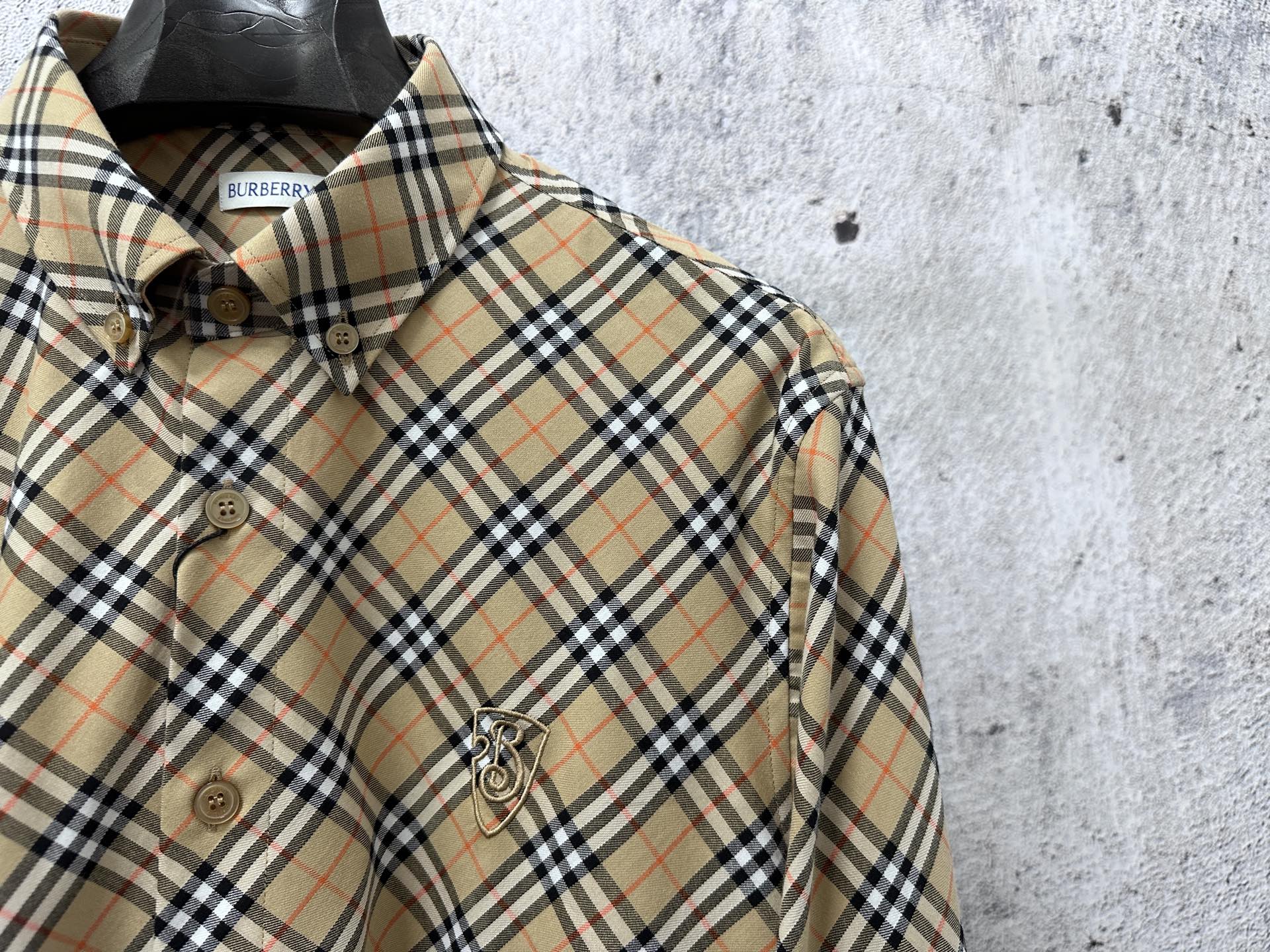 Burberry plaid long-sleeve shirt close-up, button placket and crest patch