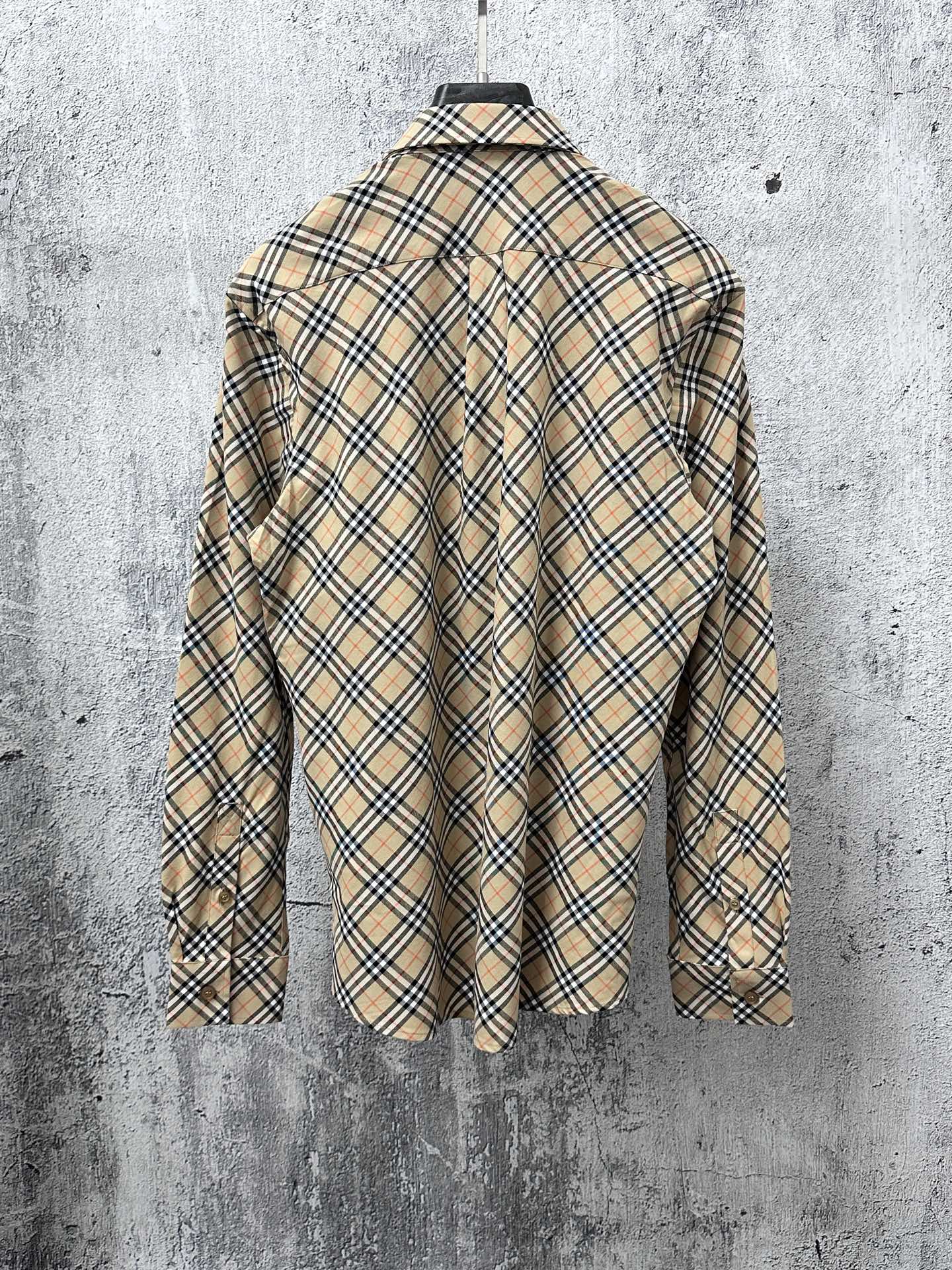 Burberry long-sleeve plaid shirt, back view on hanger with button detailing