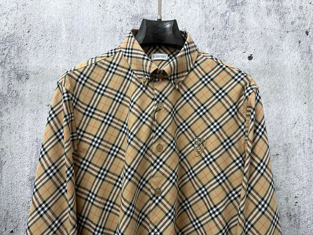 Burberry plaid long-sleeve button-up shirt on hanger