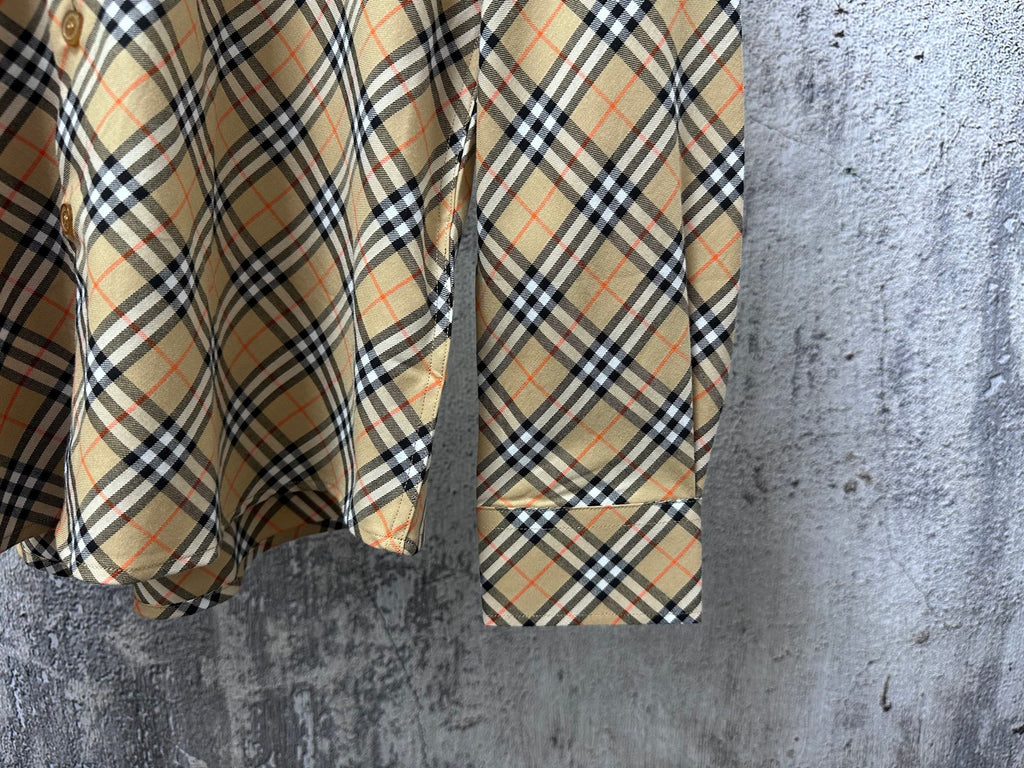Burberry plaid shirt sleeve and hem detail with buttoned cuff
