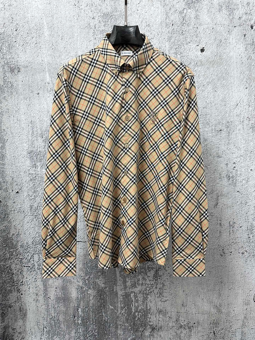 Burberry long-sleeve plaid button-up shirt with dark collar and button front