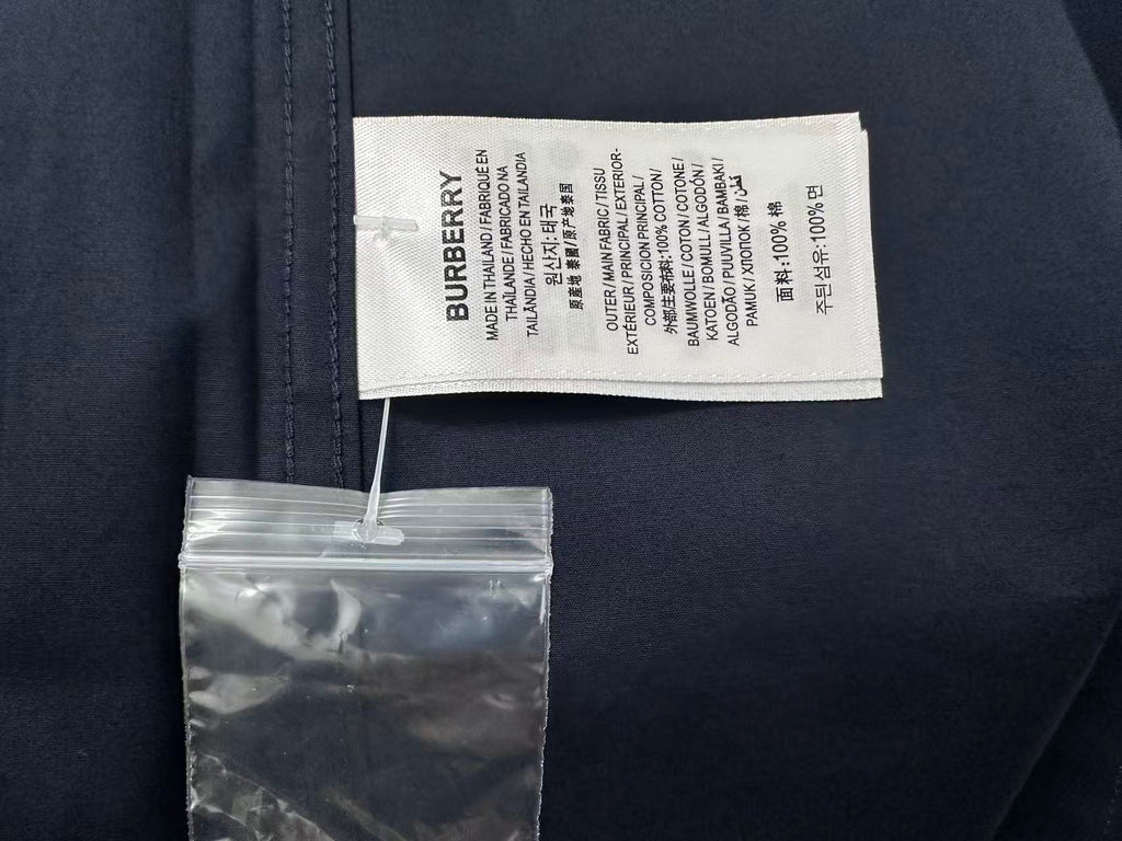 Burberry shirt care label and size tag on dark navy collar